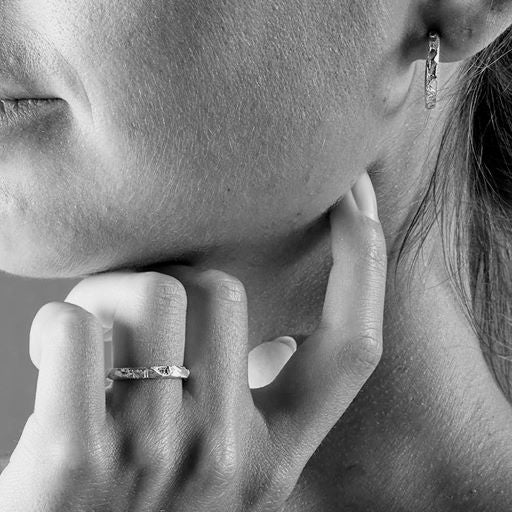 Iwa Classic Exquisite simple silver ring with champagne colored diamond.