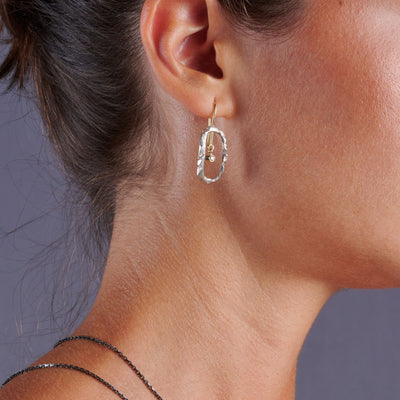 Iwa Exquis Exquisite silver/gold earrings with brilliants.