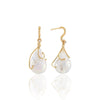 Yuuki Albe Exquisite gold earrings with diamonds and white pearls.