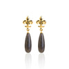 Hanako Lily Timeless gold earrings with drop-shaped stone.